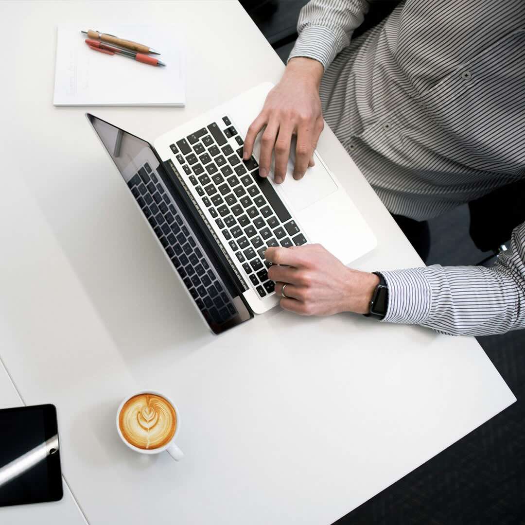 picture of a person typing on a computer